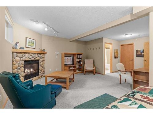 1077 Wilson Way, Canmore, AB - Indoor Photo Showing Other Room With Fireplace