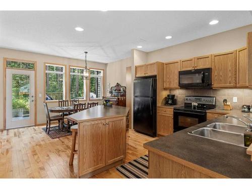 1077 Wilson Way, Canmore, AB - Indoor Photo Showing Kitchen With Double Sink