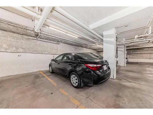 208-730 5 Street Ne, Calgary, AB - Indoor Photo Showing Garage