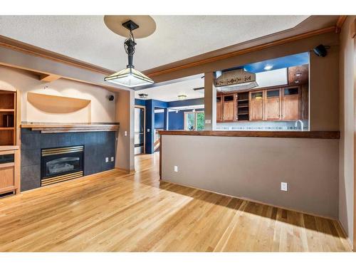 4020 Commanche Road Nw, Calgary, AB - Indoor Photo Showing Other Room With Fireplace