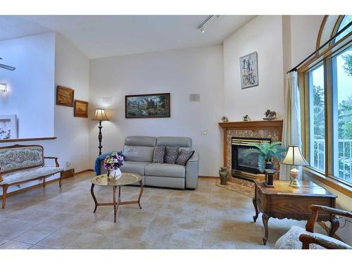 8 Hamptons Rise Nw, Calgary, AB - Indoor Photo Showing Living Room With Fireplace