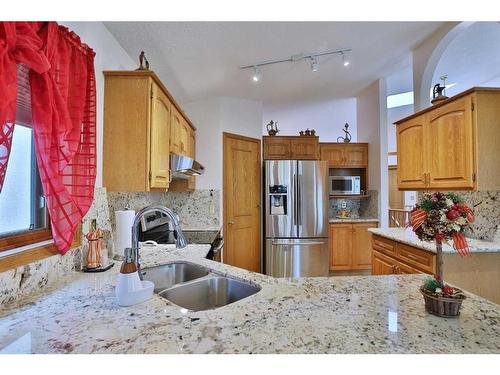 8 Hamptons Rise Nw, Calgary, AB - Indoor Photo Showing Kitchen With Stainless Steel Kitchen With Double Sink