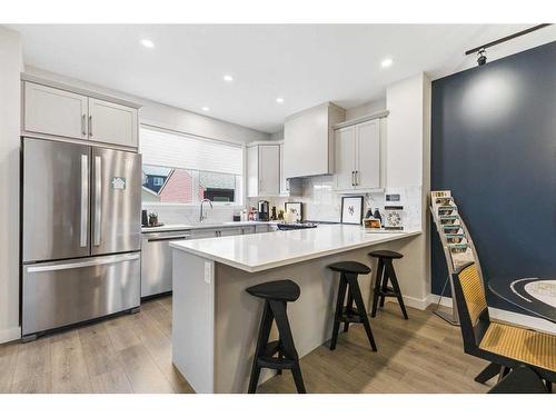 63 Heirloom Boulevard Se, Calgary, AB - Indoor Photo Showing Kitchen With Stainless Steel Kitchen With Upgraded Kitchen