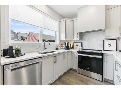 63 Heirloom Boulevard Se, Calgary, AB - Indoor Photo Showing Kitchen With Stainless Steel Kitchen With Double Sink