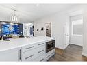 63 Heirloom Boulevard Se, Calgary, AB  - Indoor Photo Showing Kitchen 