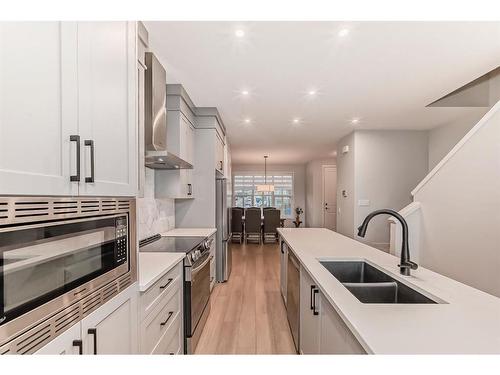 230 Aquila Drive Nw, Calgary, AB - Indoor Photo Showing Kitchen With Double Sink With Upgraded Kitchen