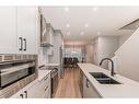 230 Aquila Drive Nw, Calgary, AB  - Indoor Photo Showing Kitchen With Double Sink With Upgraded Kitchen 