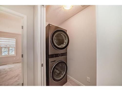 230 Aquila Drive Nw, Calgary, AB - Indoor Photo Showing Laundry Room