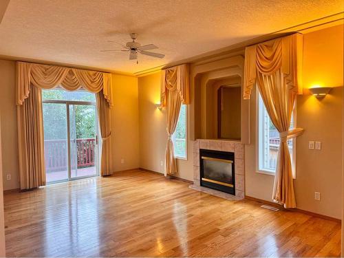 72 Millview Way Sw, Calgary, AB - Indoor Photo Showing Living Room With Fireplace