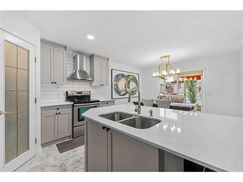 49 Morningside Bay Sw, Airdrie, AB - Indoor Photo Showing Kitchen With Double Sink