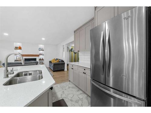 49 Morningside Bay Sw, Airdrie, AB - Indoor Photo Showing Kitchen With Stainless Steel Kitchen With Double Sink