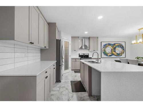 49 Morningside Bay Sw, Airdrie, AB - Indoor Photo Showing Kitchen With Double Sink With Upgraded Kitchen