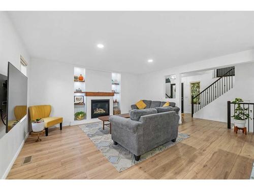 49 Morningside Bay Sw, Airdrie, AB - Indoor Photo Showing Living Room With Fireplace