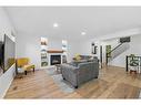 49 Morningside Bay Sw, Airdrie, AB  - Indoor Photo Showing Living Room With Fireplace 