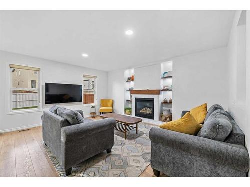 49 Morningside Bay Sw, Airdrie, AB - Indoor Photo Showing Living Room With Fireplace