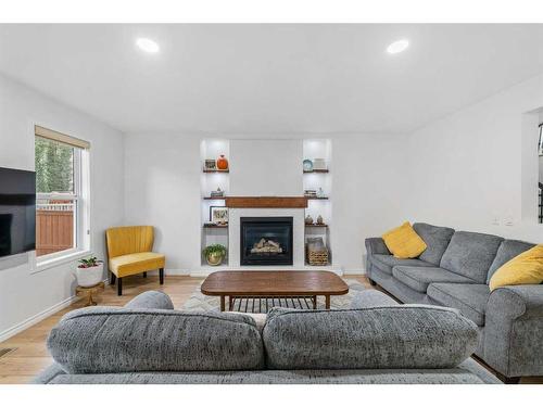 49 Morningside Bay Sw, Airdrie, AB - Indoor Photo Showing Living Room With Fireplace