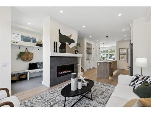 1423 Child Avenue Ne, Calgary, AB - Indoor Photo Showing Living Room With Fireplace