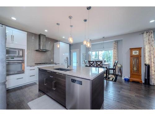 52 Cooperstown Place Sw, Airdrie, AB - Indoor Photo Showing Kitchen With Double Sink With Upgraded Kitchen