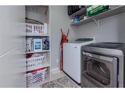 52 Cooperstown Place Sw, Airdrie, AB - Indoor Photo Showing Laundry Room