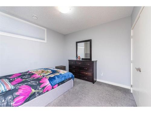 52 Cooperstown Place Sw, Airdrie, AB - Indoor Photo Showing Bedroom