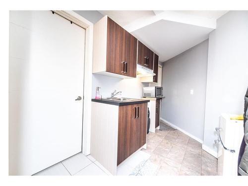 52 Cooperstown Place Sw, Airdrie, AB - Indoor Photo Showing Kitchen