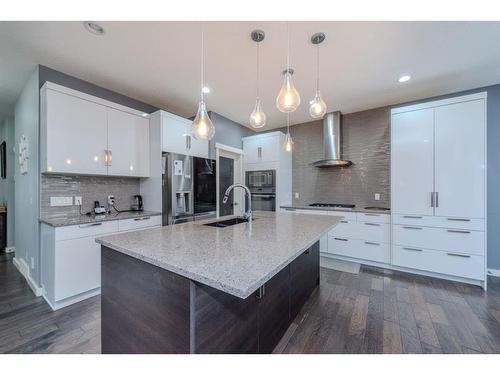 52 Cooperstown Place Sw, Airdrie, AB - Indoor Photo Showing Kitchen With Upgraded Kitchen