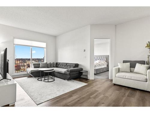 1415-1140 Taradale Drive Ne, Calgary, AB - Indoor Photo Showing Living Room