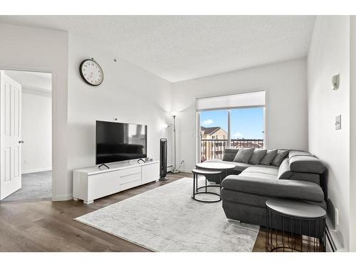 1415-1140 Taradale Drive Ne, Calgary, AB - Indoor Photo Showing Living Room