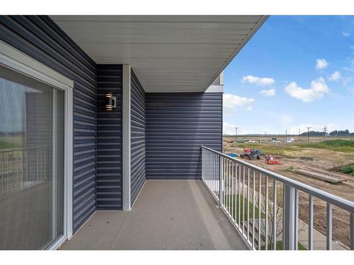 605-33 Merganser Drive West, Chestermere, AB - Outdoor With Balcony With Exterior