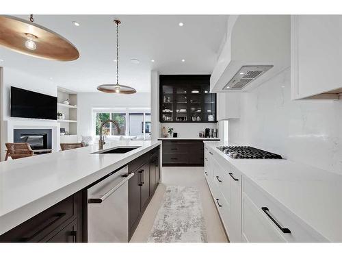 627 18 Avenue Nw, Calgary, AB - Indoor Photo Showing Kitchen With Fireplace