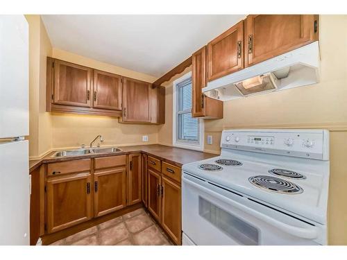 4602 Passchendaele Road Sw, Calgary, AB - Indoor Photo Showing Kitchen With Double Sink