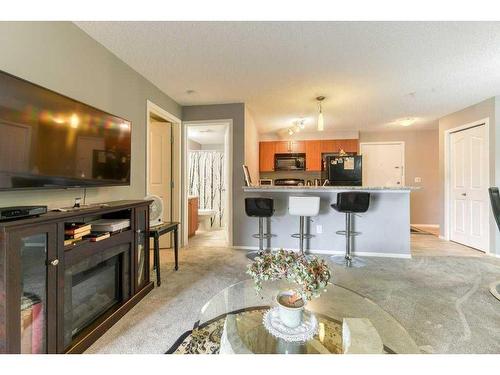 1211-60 Panatella Street Nw, Calgary, AB - Indoor With Fireplace