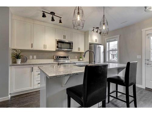 420 Cranford Mews Se, Calgary, AB - Indoor Photo Showing Kitchen With Upgraded Kitchen