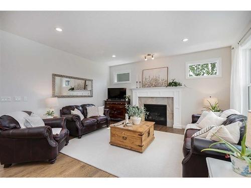 234 Baywater Way Sw, Airdrie, AB - Indoor Photo Showing Living Room With Fireplace