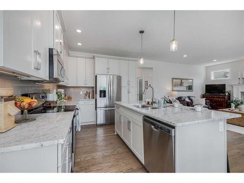 234 Baywater Way Sw, Airdrie, AB - Indoor Photo Showing Kitchen With Double Sink With Upgraded Kitchen