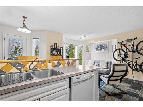 1-823 Wilson Way, Canmore, AB - Indoor Photo Showing Kitchen With Double Sink