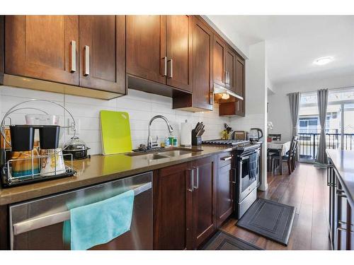 978 Sherwood Boulevard Nw, Calgary, AB - Indoor Photo Showing Kitchen With Double Sink