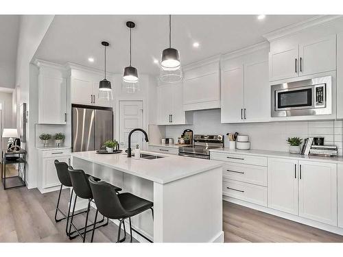 56 Drake Landing Square, Okotoks, AB - Indoor Photo Showing Kitchen With Double Sink With Upgraded Kitchen