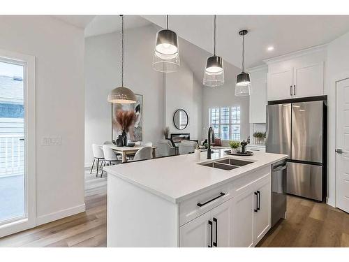 56 Drake Landing Square, Okotoks, AB - Indoor Photo Showing Kitchen With Double Sink With Upgraded Kitchen