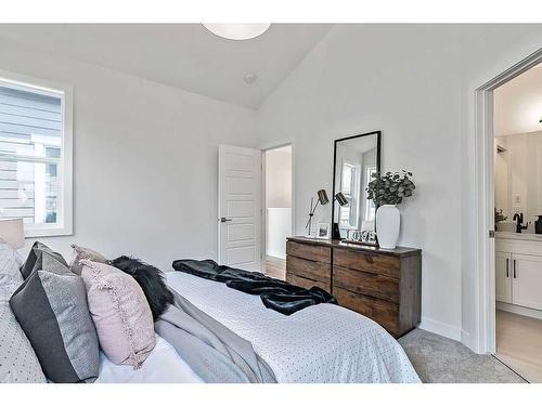 56 Drake Landing Square, Okotoks, AB - Indoor Photo Showing Bedroom