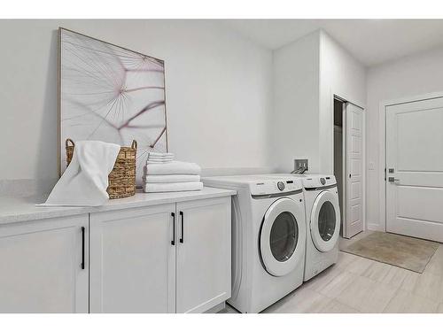 56 Drake Landing Square, Okotoks, AB - Indoor Photo Showing Laundry Room