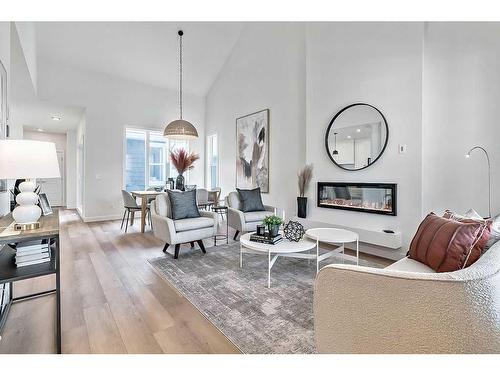 56 Drake Landing Square, Okotoks, AB - Indoor Photo Showing Living Room With Fireplace