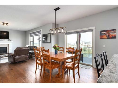 1604 Montrose Terrace East, High River, AB - Indoor Photo Showing Dining Room With Fireplace