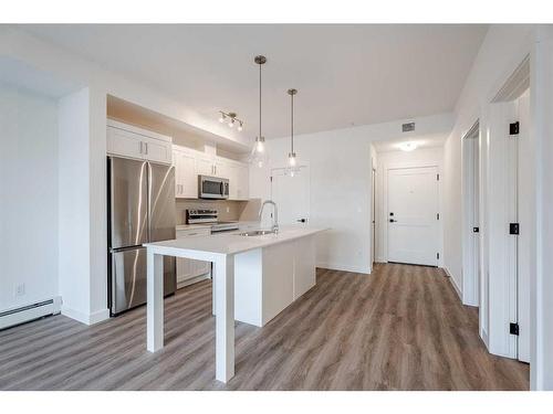 1110-200 Seton Circle Se, Calgary, AB - Indoor Photo Showing Kitchen