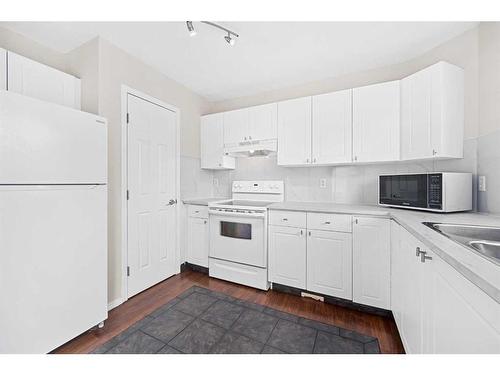 233 Arbour Grove Close Nw, Calgary, AB - Indoor Photo Showing Kitchen With Double Sink