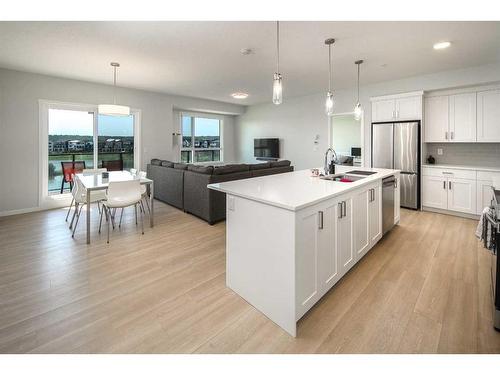 2205-42 Cranbrook Gardens Se, Calgary, AB - Indoor Photo Showing Kitchen With Upgraded Kitchen