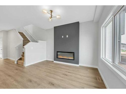 220 Savanna Terrace Ne, Calgary, AB - Indoor Photo Showing Living Room With Fireplace