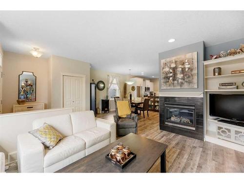 13 Prestwick Estate Gate Se, Calgary, AB - Indoor Photo Showing Living Room With Fireplace