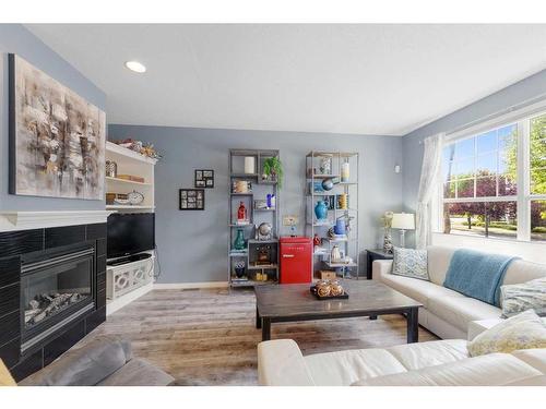 13 Prestwick Estate Gate Se, Calgary, AB - Indoor Photo Showing Living Room With Fireplace