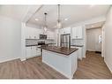 1481 Bayview Point, Airdrie, AB  - Indoor Photo Showing Kitchen With Double Sink With Upgraded Kitchen 